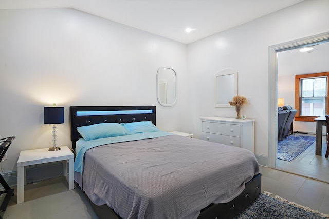 bedroom featuring lofted ceiling