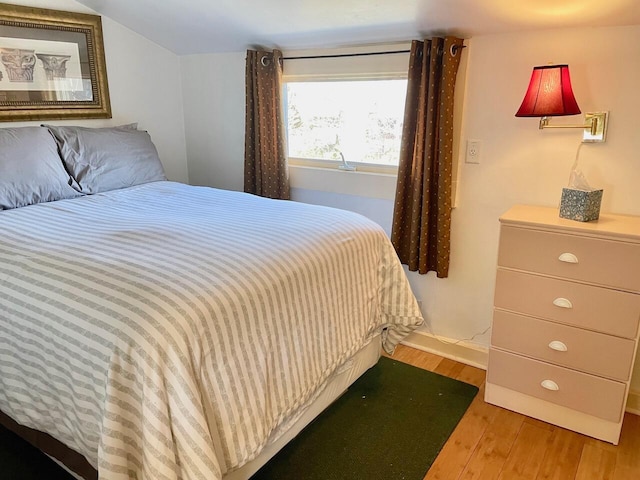 bedroom with light hardwood / wood-style floors