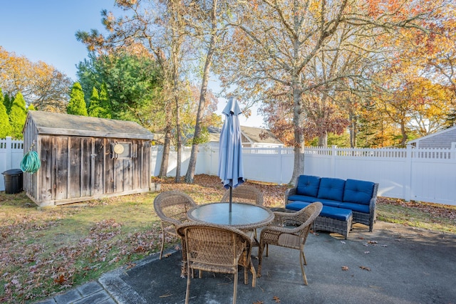 view of patio / terrace featuring a storage shed