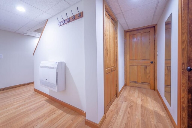 12 Tree Top Ln, East Falmouth, MA 02536 - hall with heating unit, a drop ceiling, and light wood-style flooring