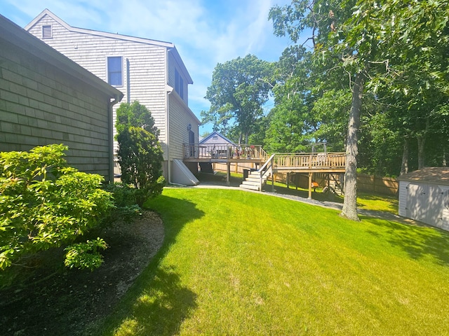12 Tree Top Ln, East Falmouth, MA 02536 - view of green lawn with a shed, a deck, and stairs