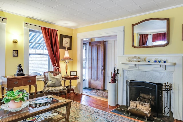 6 Winslow St, Provincetown, MA 02657 - sitting room featuring a high end fireplace, crown molding, and dark wood-type flooring