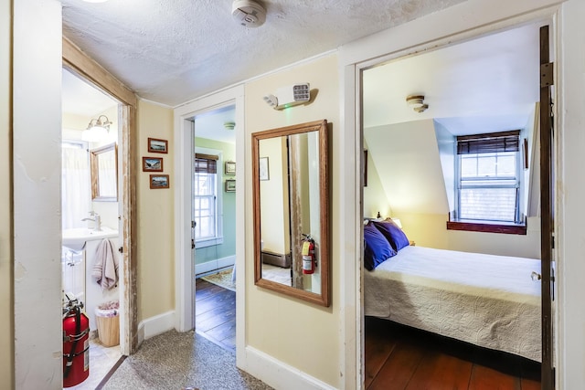 6 Winslow St, Provincetown, MA 02657 - carpeted bedroom featuring a textured ceiling and multiple windows