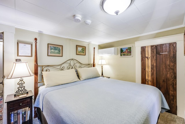 bedroom with crown molding and a wall mounted AC