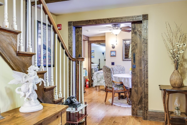 entryway with light hardwood / wood-style flooring and ceiling fan