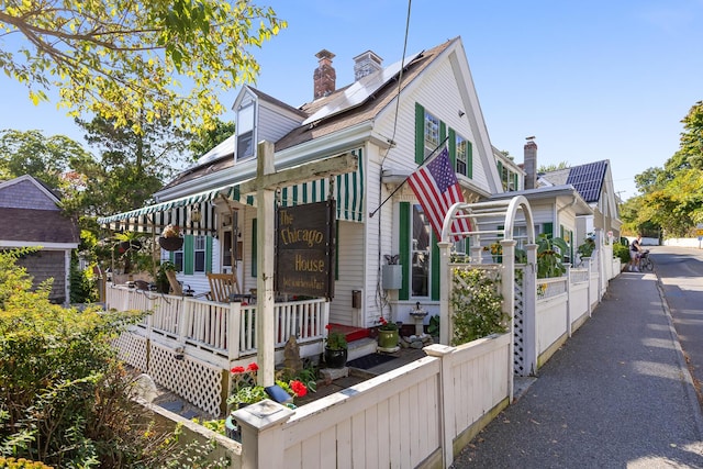 exterior space featuring a porch and solar panels