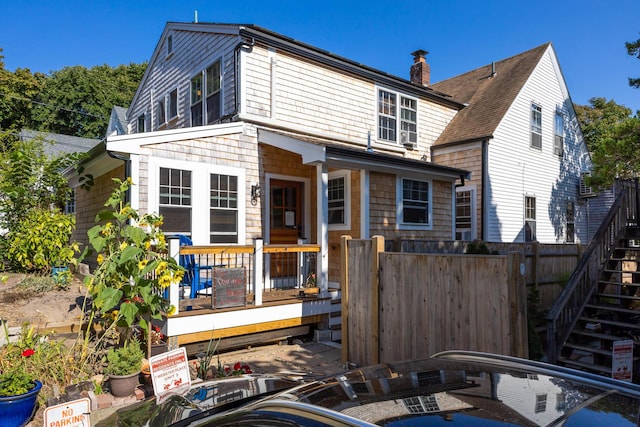 view of front of home featuring a wooden deck