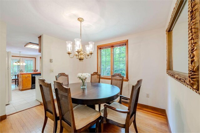31 Woodridge Rd, East Sandwich, MA 02537 - dining area with a chandelier, plenty of natural light, light wood finished floors, and baseboards