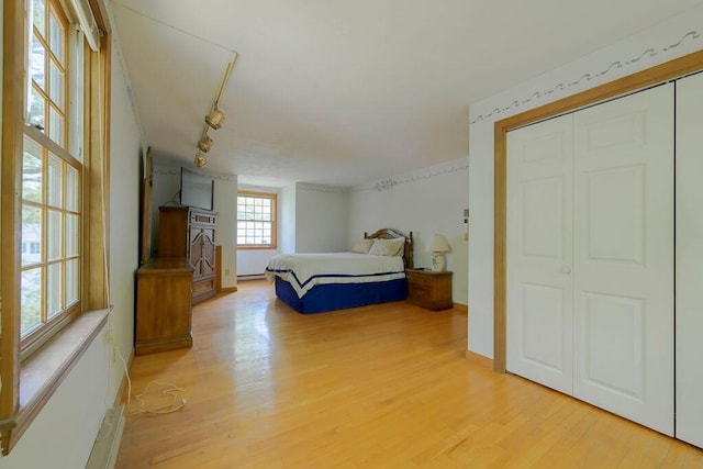 31 Woodridge Rd, East Sandwich, MA 02537 - bedroom featuring light wood-type flooring, a closet, and baseboard heating