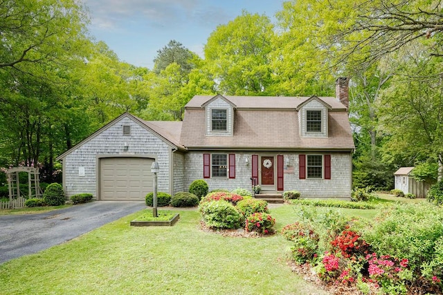 31 Woodridge Rd, East Sandwich, MA 02537 - dutch colonial with driveway, an attached garage, a chimney, a storage unit, and a front lawn