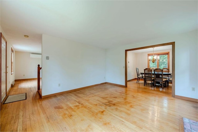 31 Woodridge Rd, East Sandwich, MA 02537 - living area with a chandelier, light wood finished floors, and baseboards