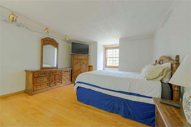 31 Woodridge Rd, East Sandwich, MA 02537 - bedroom with light wood-type flooring and baseboards