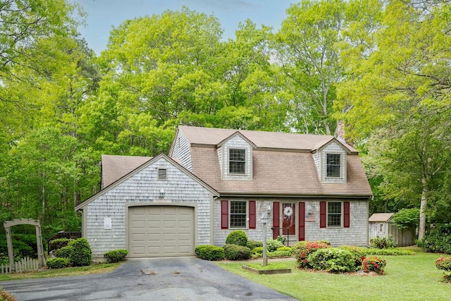 31 Woodridge Rd, East Sandwich, MA 02537 - view of front of house with asphalt driveway, a garage, a front lawn, and a chimney