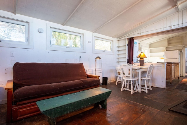 living room with dark hardwood / wood-style flooring and vaulted ceiling