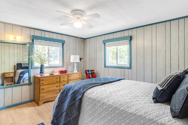 190 Meadow Ave W, Wellfleet, MA 02667 - bedroom featuring wood finished floors, a ceiling fan, and wooden walls