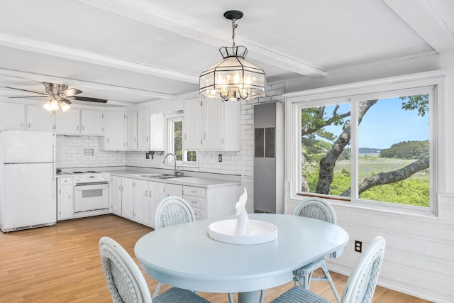 190 Meadow Ave W, Wellfleet, MA 02667 - dining room featuring healthy amount of natural light, beam ceiling, a chandelier, light wood-style floors, and ceiling fan