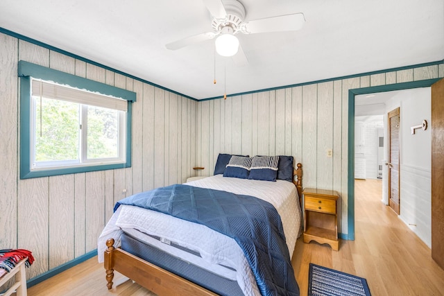 190 Meadow Ave W, Wellfleet, MA 02667 - bedroom with wood finished floors, wooden walls, and a ceiling fan