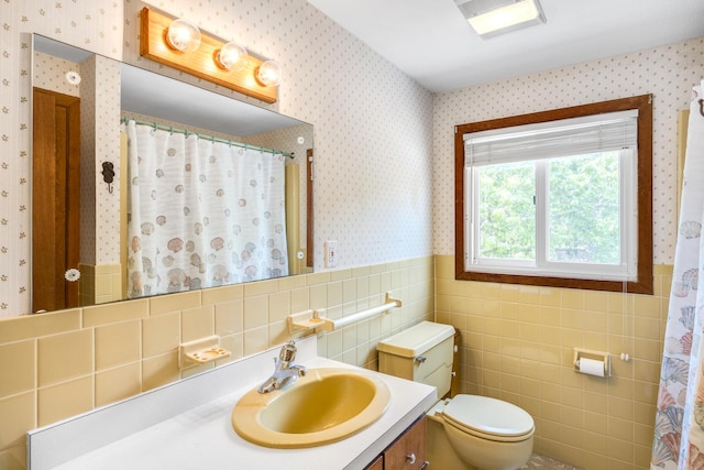 190 Meadow Ave W, Wellfleet, MA 02667 - full bath with wallpapered walls, tile walls, vanity, wainscoting, and a shower with curtain
