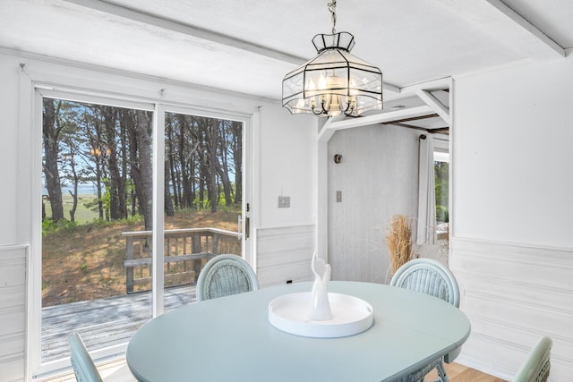 190 Meadow Ave W, Wellfleet, MA 02667 - dining room featuring a chandelier, a wainscoted wall, and beamed ceiling
