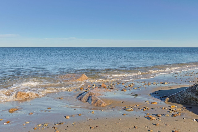 property view of water featuring a beach view