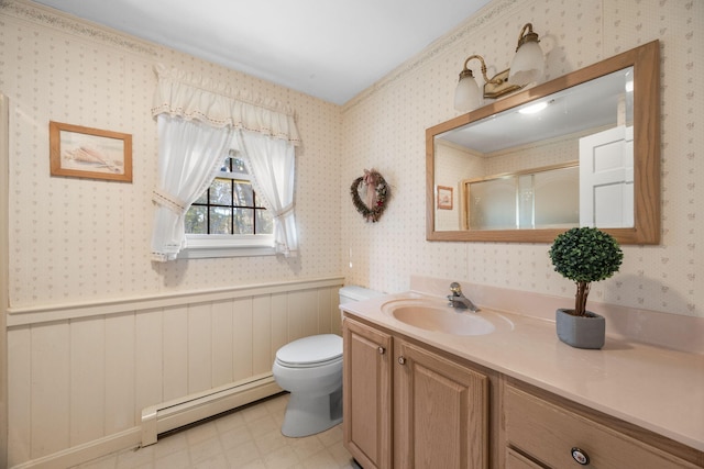 bathroom featuring baseboard heating, toilet, vanity, and walk in shower