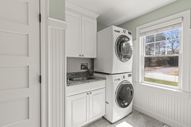 31 Seatucket Rd, East Falmouth, MA 02536 - washroom with a sink, stacked washer / drying machine, and cabinet space
