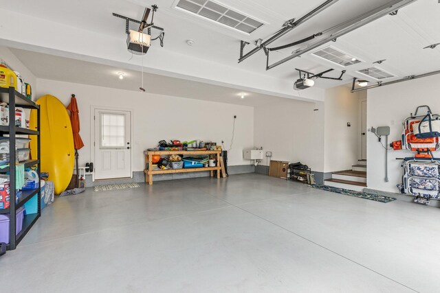 31 Seatucket Rd, East Falmouth, MA 02536 - garage featuring a garage door opener