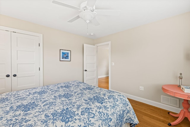 31 Seatucket Rd, East Falmouth, MA 02536 - bedroom featuring visible vents, a closet, wood finished floors, baseboards, and a ceiling fan