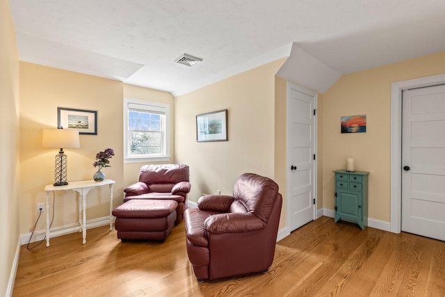 31 Seatucket Rd, East Falmouth, MA 02536 - living area featuring light wood-style floors, baseboards, visible vents, and vaulted ceiling