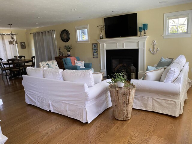31 Seatucket Rd, East Falmouth, MA 02536 - living room with recessed lighting, plenty of natural light, wood finished floors, and a fireplace