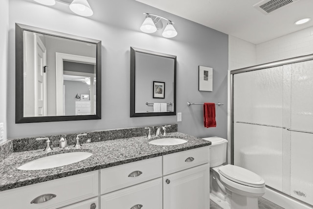 31 Seatucket Rd, East Falmouth, MA 02536 - full bathroom with a sink, a stall shower, toilet, and visible vents