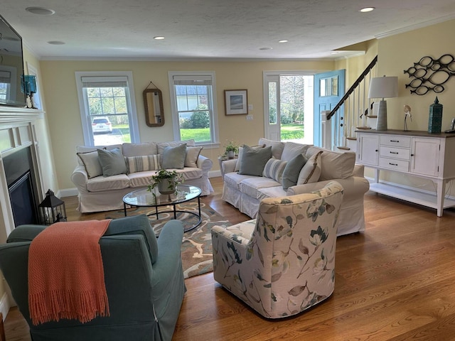 31 Seatucket Rd, East Falmouth, MA 02536 - living area with plenty of natural light, ornamental molding, wood finished floors, and stairway