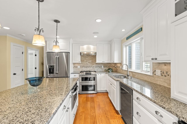 31 Seatucket Rd, East Falmouth, MA 02536 - kitchen featuring a sink, ornamental molding, stainless steel appliances, and white cabinetry