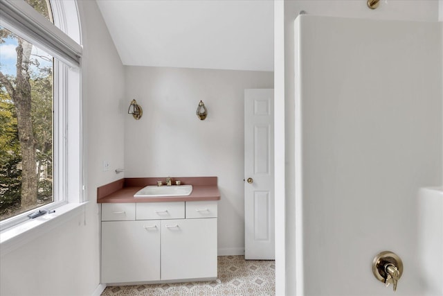 bathroom featuring vanity and baseboards