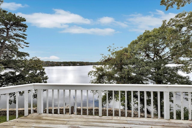 wooden deck with a water view