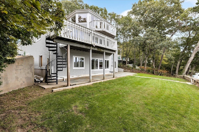 rear view of property with a patio area, a wooden deck, stairs, and a yard