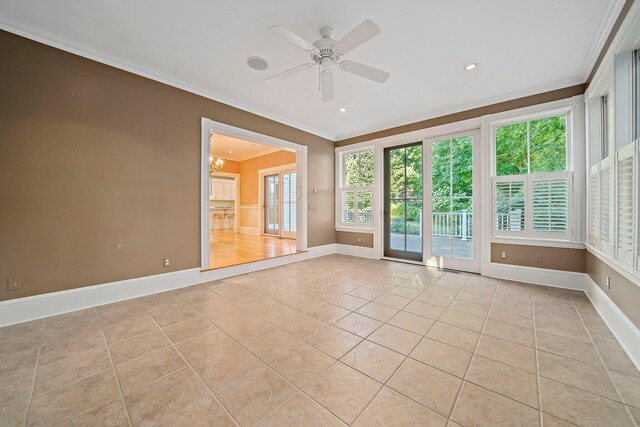 unfurnished room with ceiling fan, light tile patterned floors, and crown molding