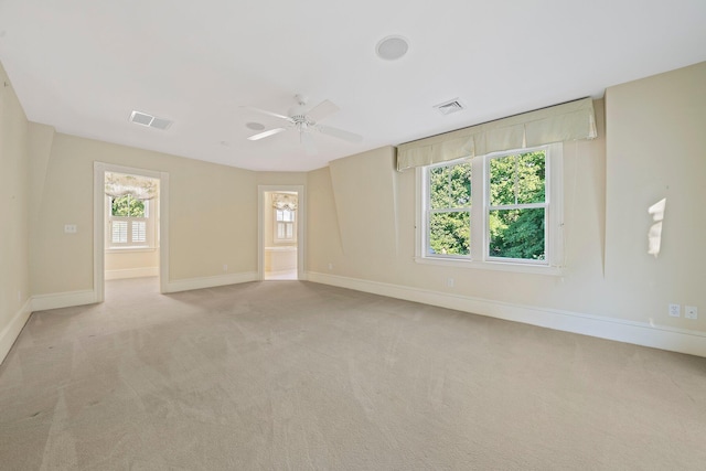 carpeted empty room with ceiling fan