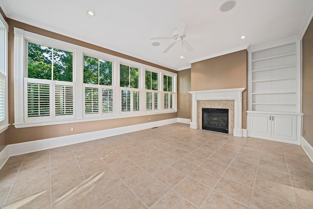 unfurnished living room with ceiling fan, light tile patterned floors, built in features, and crown molding