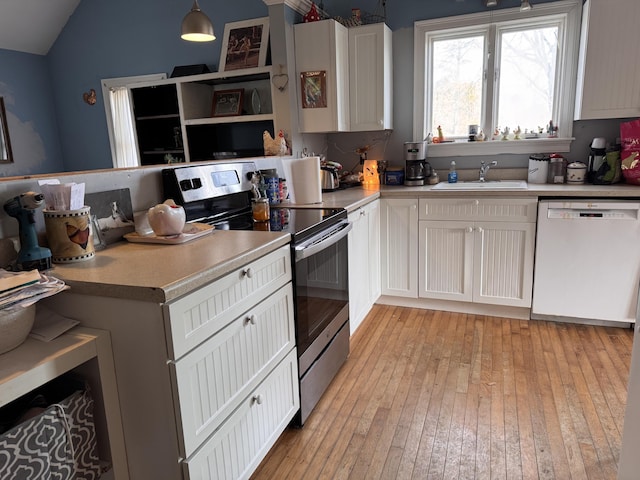 kitchen featuring sink, white cabinetry, hanging light fixtures, white dishwasher, and stainless steel electric stove