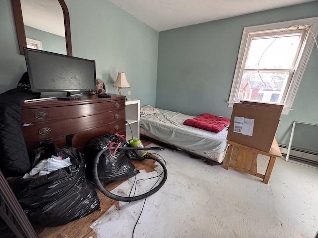 bedroom featuring baseboard heating