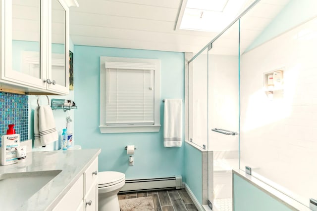 bathroom with a baseboard heating unit, wood tiled floor, a stall shower, and tasteful backsplash