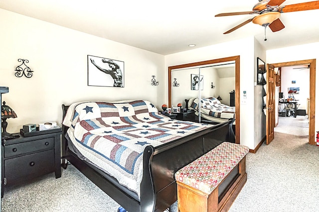 bedroom with a ceiling fan, carpet, a closet, and baseboards