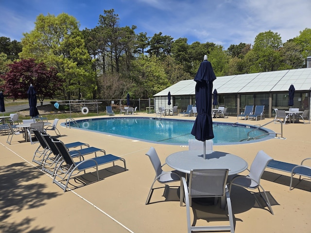 107 Court Way, Brewster, MA 02631 - community pool featuring fence, a patio, and view of scattered trees