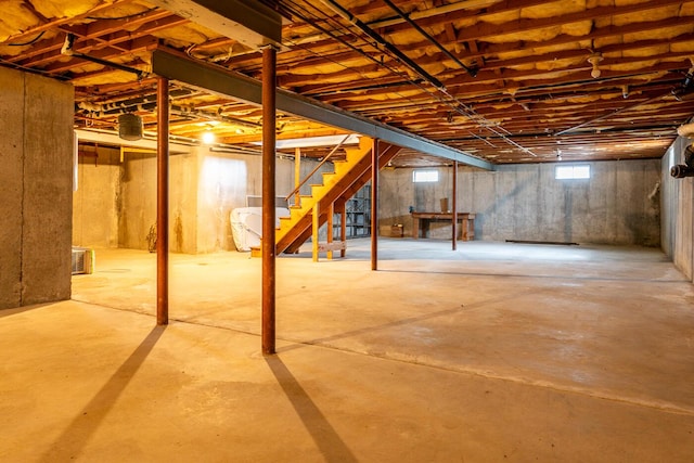 basement featuring stairs