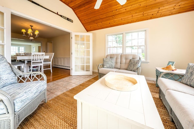 living area with vaulted ceiling, a chandelier, wooden ceiling, a baseboard radiator, and light tile patterned floors