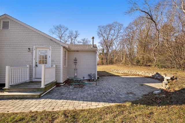 back of property featuring a patio