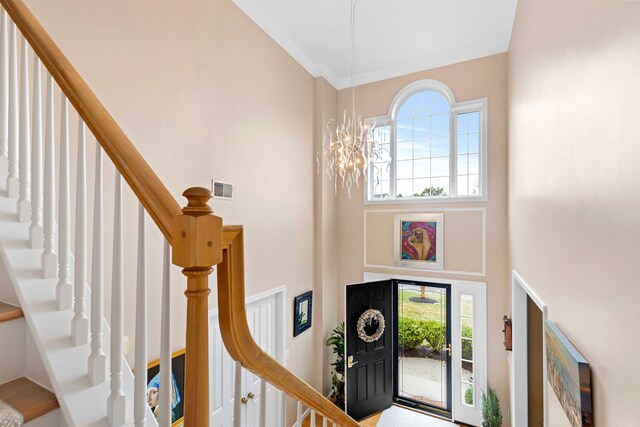 415 Raymond Rd, Plymouth, MA 02360 - foyer with visible vents, an inviting chandelier, a towering ceiling, and stairs