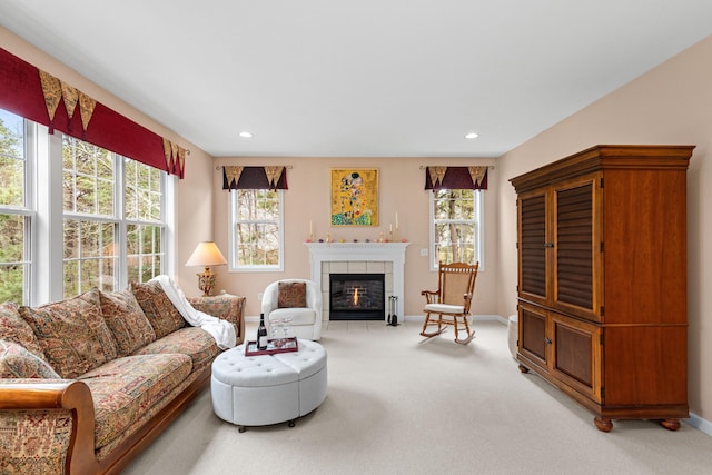 415 Raymond Rd, Plymouth, MA 02360 - living room featuring baseboards, a tile fireplace, light carpet, and a healthy amount of sunlight