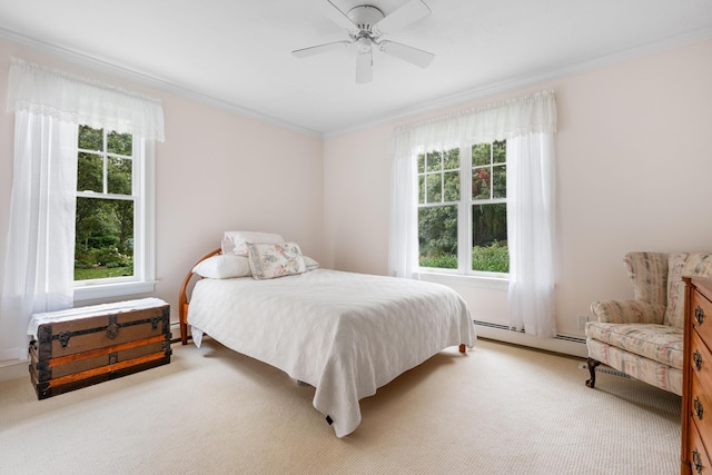 bedroom with ceiling fan, light colored carpet, a baseboard heating unit, and ornamental molding